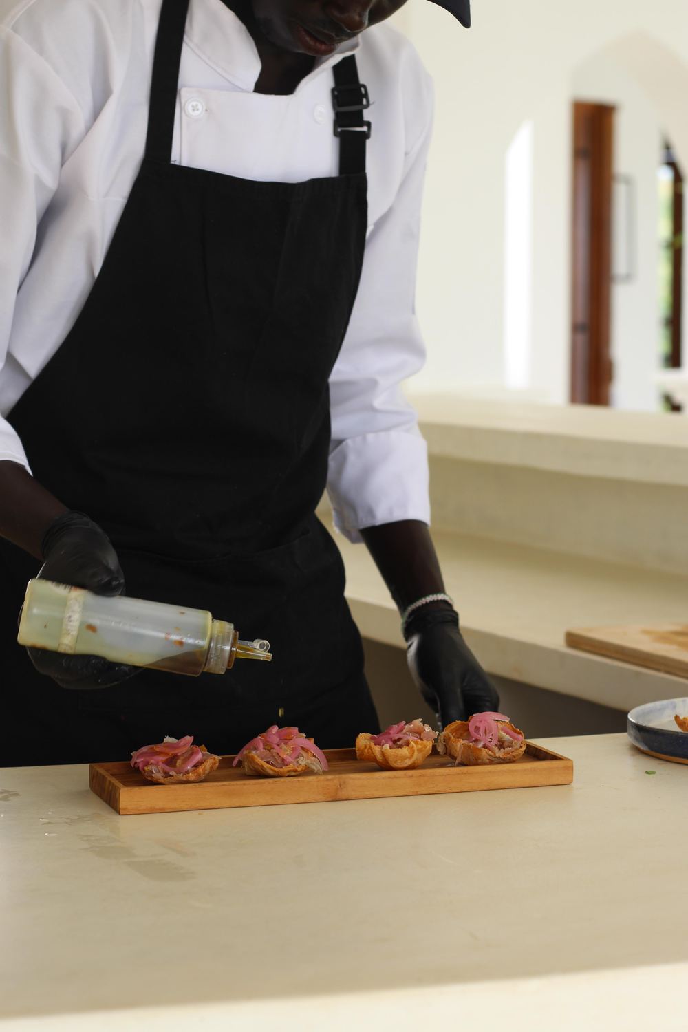 Plated canapés with pickled onion