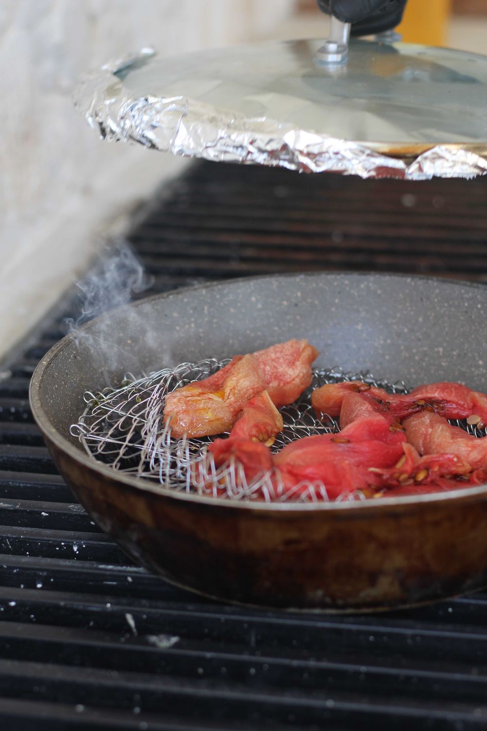 Meat smoking on the wood-fired grill