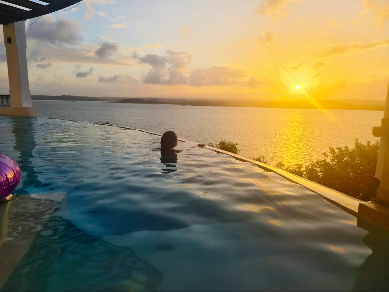 An evening swim in the infinity pool at sunset
