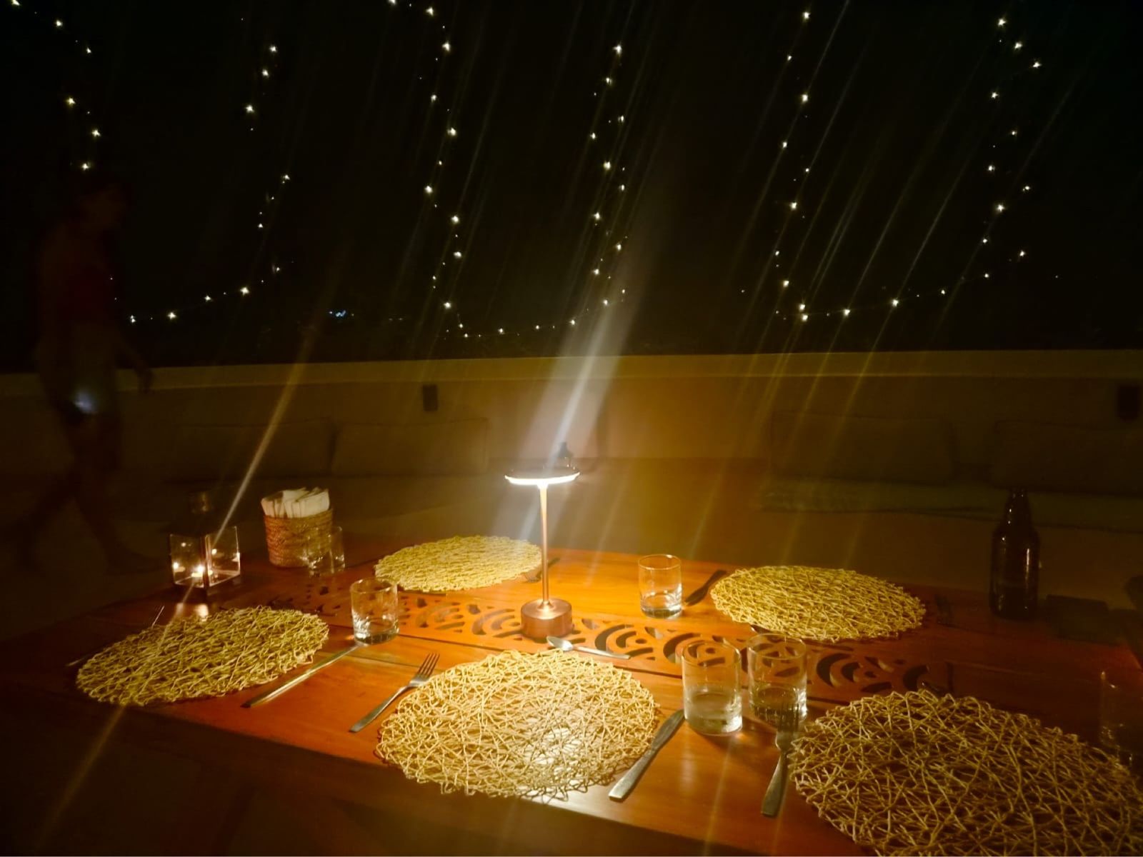 Dinner under the fairy lights on the rooftop terrace
