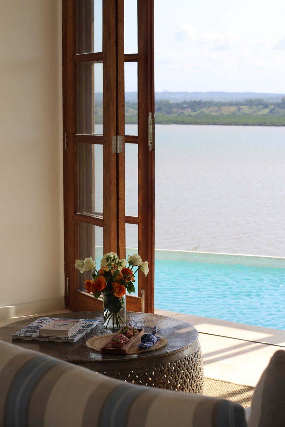 Roses and books beside the infinity pool